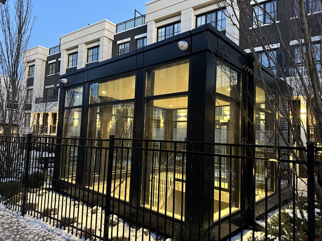 A building with a black metal fence and some windows